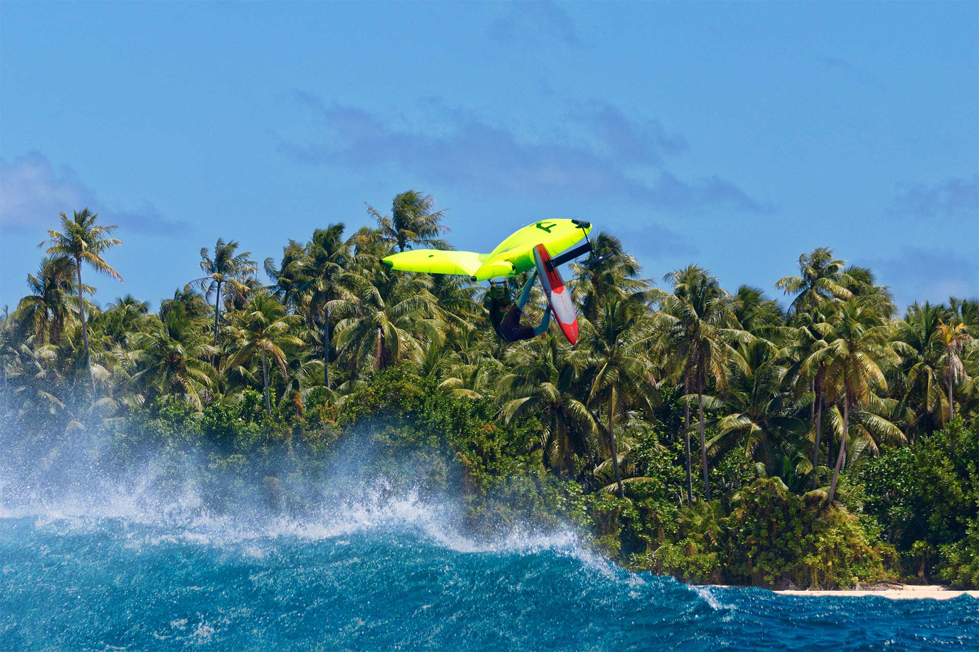 KT Foiling rider jumping above tropical water on a Super K 2 board